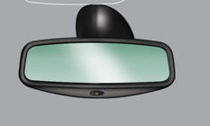 By means of a sensor, which measures the light from the rear of the vehicle,