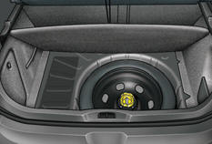 The spare wheel is installed in the boot under the floor.