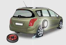 The spare wheel is supported by a winch system underneath the rear of the vehicle.