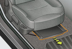 The storage drawer is located under the front passenger's seat.